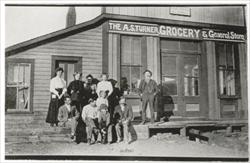 Old photo of men standing outside a Garo grocery store